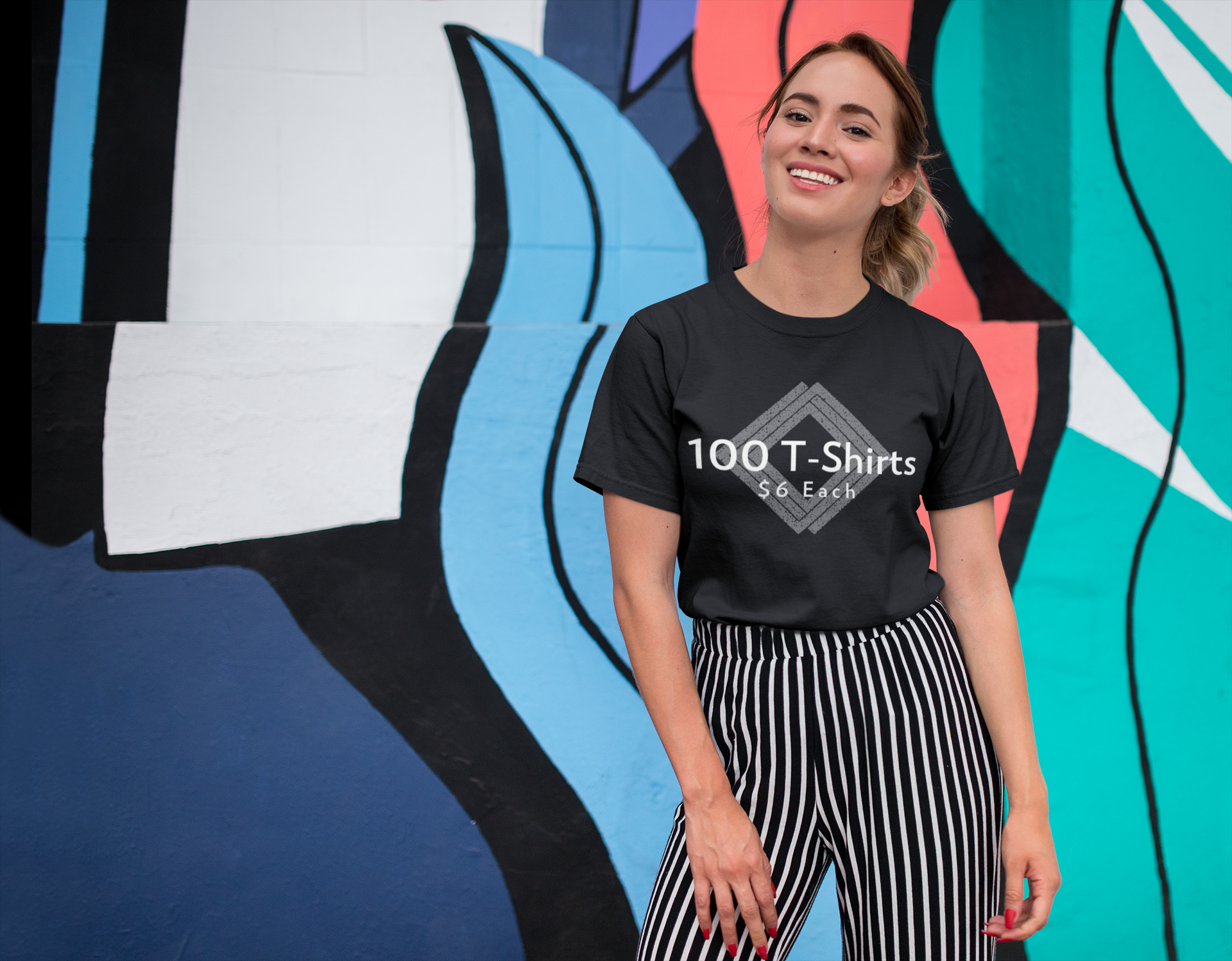 tee-mockup-of-a-smiling-girl-in-front-of-a-wall-with-colorful-illustrations-26646